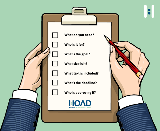 Designer reviewing a creative brief at their desk